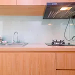 Modern Style Studio Tamansari Mahogany Karawang Apartment With City View By Travelio